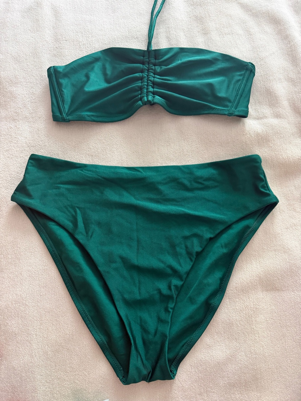 Metallic like emerald green 2 piece bathing suit. It’s beautiful in person.